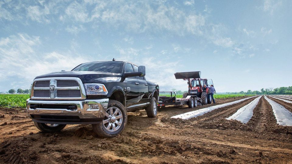 Ram 2500 truck towing at a work site